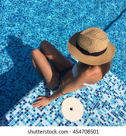 Close Up Portrait Of Beautiful Girl On The Top Of Rooftop In A Pool. Pool Party. Sport Fitness Girl. Straw Hat On A Beautiful Sexy Girl