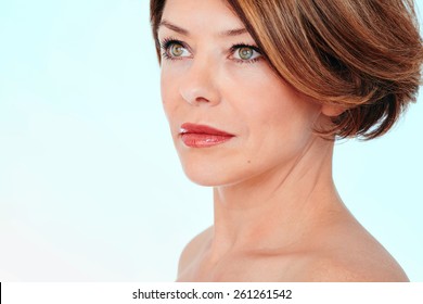 Close Up Portrait Of Beautiful Middle Aged Woman Looking Aside