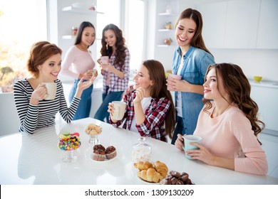 Close Up Portrait Beautiful She Her Ladies Missed Family Meeting Sister Cousins Stand Sit Round Big White Table Bright Kitchen Hold Cups Share Novelty Emotional Girls Day Night Holiday