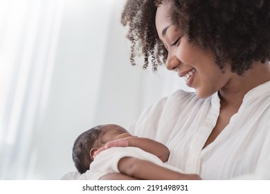 Close Up Portrait Of Beautiful Young African American  Mother Holding Sleep Newborn Baby In Hospital. Healthcare Medical Love Black Afro Woman Lifestyle Mother's Day, Breast Concept With Copy Space. 