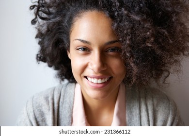 Close up portrait of a beautiful young african american woman smiling - Shutterstock ID 231366112