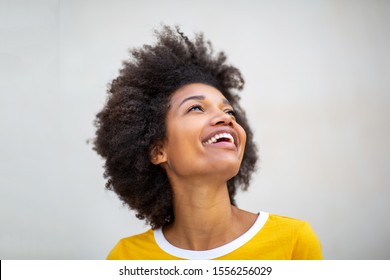 Close Up Portrait Of Beautiful Young Black Woman Laughing And Looking Up