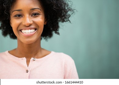 Close Up Portrait Beautiful Young Black Woman Smiling By Green Background