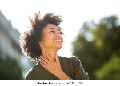 Close Up Portrait Beautiful Young Black Woman Smiling Outdoors And Looking Away