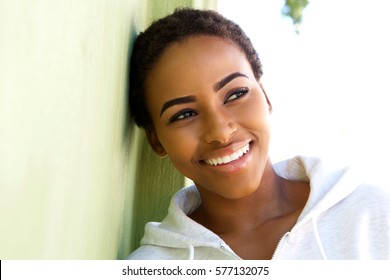 Close Up Portrait Of Beautiful Young Black Woman Smiling Outside