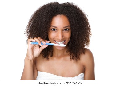 Close Up Portrait Of A Beautiful Young Woman Brushing Teeth On Isolated White Background