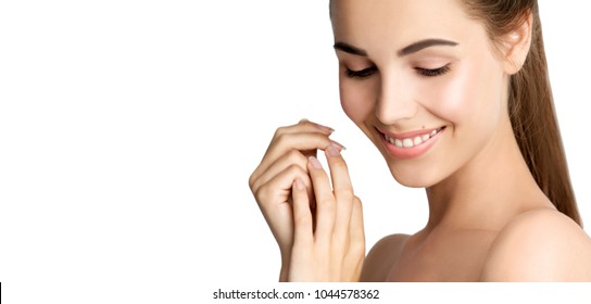 Close up portrait of beauty smiling model with natural nude make up. Spa, skincare and wellness. Beautiful young woman with clean perfect skin. Isolated on white background, copyspace.