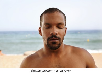 Close Up Portrait Of Black Man With Eyes Closed. 