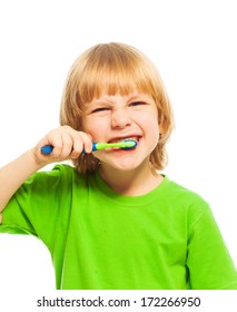 Close portrait of blond 4 years old boy boy brushing teeth with toothpaste 
