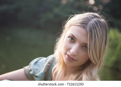 Close up portrait of a blonde girl wearing a medieval costume. - Shutterstock ID 712611250