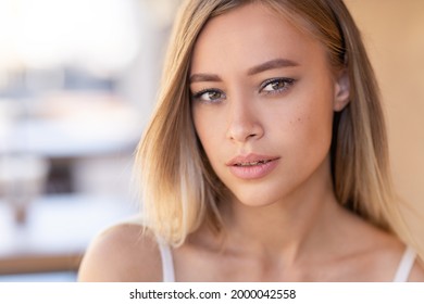 Close Up Portrait Of A Blonde Woman With Pretty Face