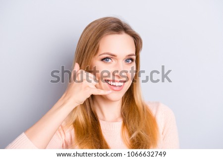 Close up portrait of charming cute adorable attractive pretty cute confident beautiful with blue eyes lady with long straight hairdo making gesture to call her isolated on gray background