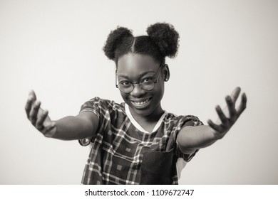 Close Up Portrait Of Cheerful African Female Showing Kindness And Politeness. Black And White Photo