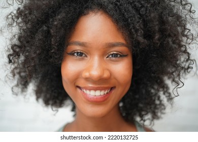 Close Up Portrait Of A Cheerful Afro Girl Smile With Happiness In The Morning.