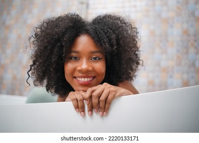 Close Up Portrait Of A Cheerful Afro Girl Smile With Happiness In The Morning.