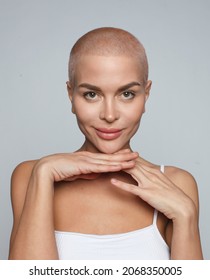 Close Up Portrait Of Cheerful Buzz Haircut Woman Isolated On Gray Background