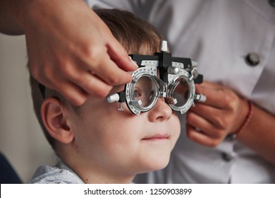 Close up portrait of child in special glasses in ophthalmologist cabinet. - Powered by Shutterstock