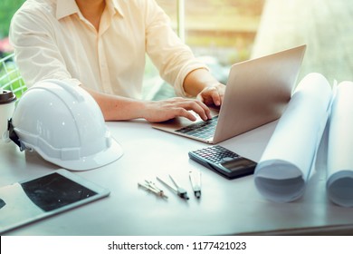 Close Up Portrait Of Civil Engineer Using Laptop To  Planning Project Schedule., Engineering And Construction Concept.