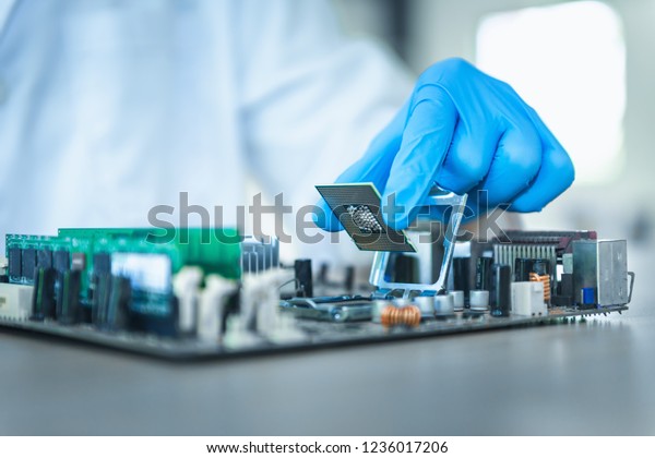 Close up portrait of computer engineer\'s hand\
is holding CPU\'s\
computer.