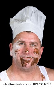 A Close Up Portrait Of A Cook With Sloppy Dress And Messy Cake Ingredients.