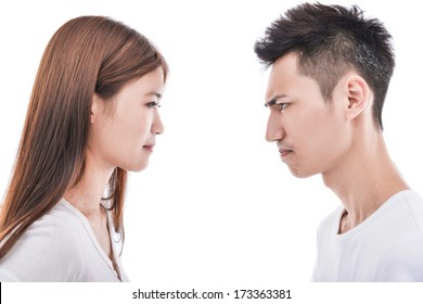 Close Up Portrait Of Couple Looking At Each Other With Wondering Expression .