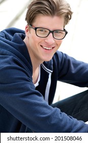 Close Up Portrait Of A Cute Guy Smiling With Glasses