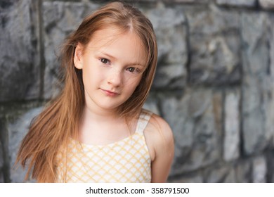 Close Up Portrait Of A Cute Little Girl Of 7-8 Years Old