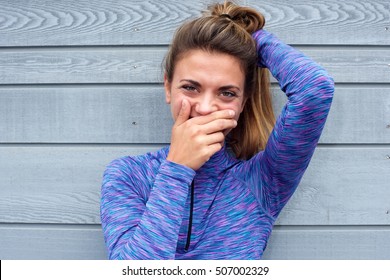 Close Up Portrait Of Cute Shy Woman Hiding Smile Behind Hand