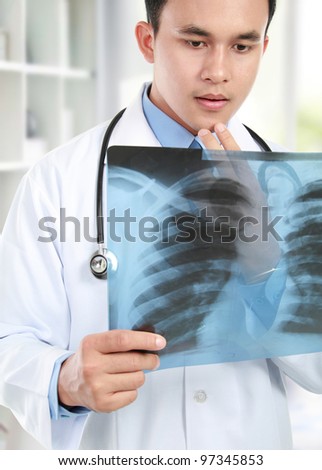 close up portrait of doctor looking at chest x ray