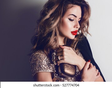 Close Up Portrait Of Elegant Luxurious Woman In Trendy Gold Sequin Party Dress . Elegant Wavy Hairstyle, Bright Make Up, Red Lips.