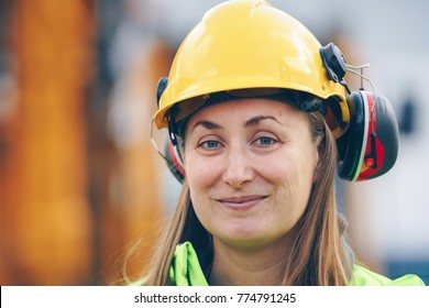 Close Up Portrait Of Female Construction Worker In Hard Hat Smiling