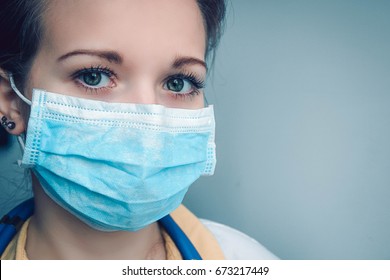 Close Up Portrait Of Female Doctor Or Nurse Wearing Protective Mask