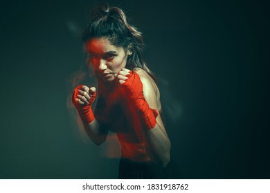 Close Portrait Of A Female Mixed Martial Arts Fighter With A Bandage On Her Hands. Long Exposure Shot