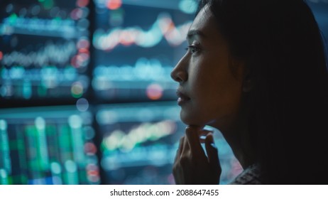 Close Up Portrait of Financial Analyst Working on Computer with Multi-Monitor Workstation with Real-Time Stocks, Commodities and Exchange Market Charts. Businesswoman at Work in Investment Agency. - Shutterstock ID 2088647455