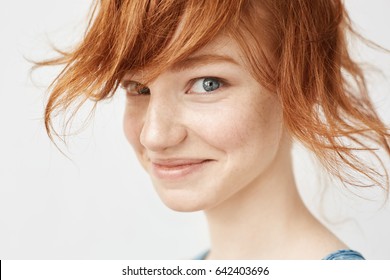 Close Up Portrait Of Funny Redhead Girl Smiling Looking At Camera.