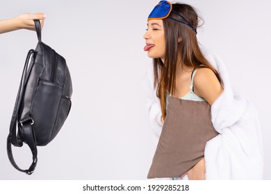 Close Portrait Of Funny Young Woman, Awake In The Morning, Showing The Tongue Out To School Backpack In The Morning. Teen Skipping Lessons.