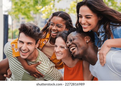 Close up portrait of a group of smiling multiracial teenage friends having fun outdoors. Cherful young people laughing together on vacation. Lifestyle concept. High quality photo - Powered by Shutterstock