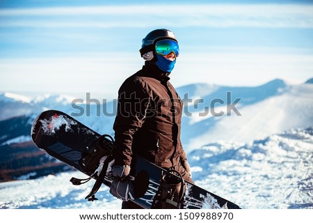 Close up portrait guy holding snowboard in winter, sports wear, helmet, sunglasses, winter, up, freedom, nature, attractive, clothes, sport, competitions, winter holidays, alps, travel, hiking