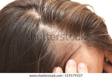 Close up portrait of the hair of a forty years old woman