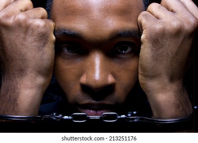 Close Up Portrait Of Hand Cuffed Black Man