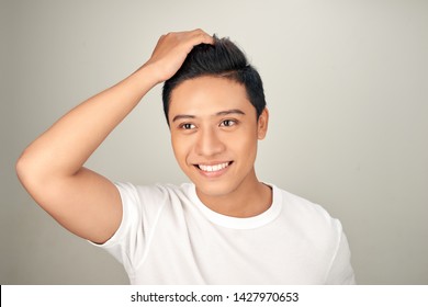 Close Up Portrait Of  Handsome Asian Man Touching His Perfect Hair