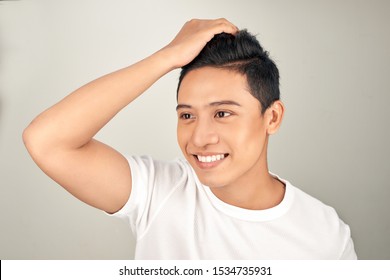 Close Up Portrait Of  Handsome Asian Man Touching His Perfect Hair