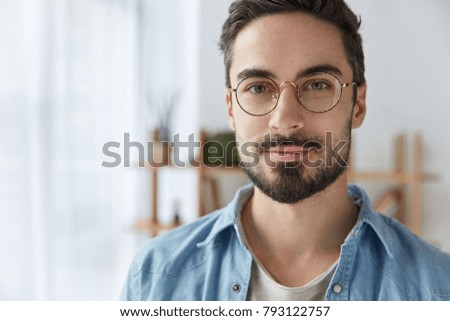 Similar – Image, Stock Photo Portrait of a bearded mature adult casual businessman with glasses looking into camera