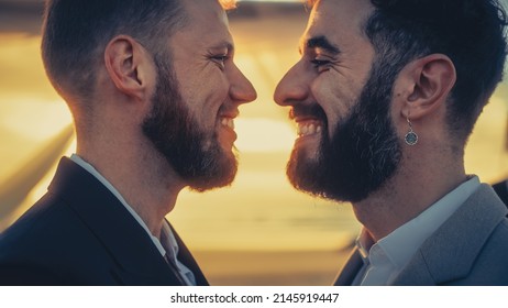 Close Up Portrait Of Handsome Gay Couple Kiss At Outdoors Wedding Ceremony Venue Near The Sea. Two Happy Men In Love Share Their Vows And Get Married. LGBTQ Relationship Goals.