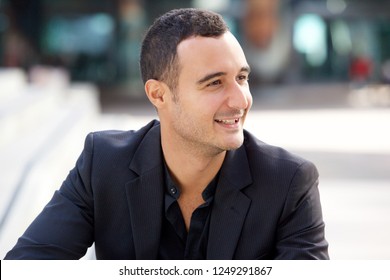 Close Up Portrait Of Handsome Man Smiling Outside