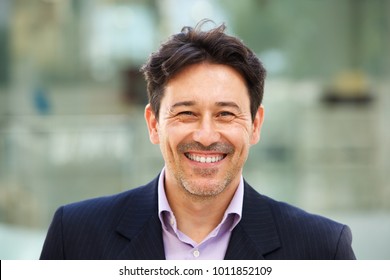 Close Up Portrait Of Handsome Older Man In Suit With Big Smile On His Face