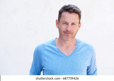 Close Up Portrait Of Handsome Older Man Standing And Thinking