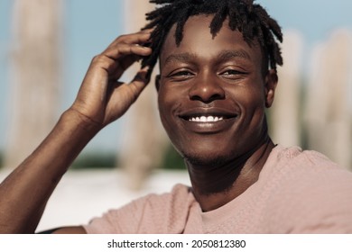 Close Up Portrait Of Handsome Smiling African American Black Man, With Curly Hair, Happy Man Outdoors