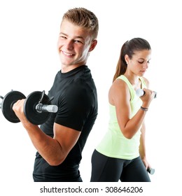 Close up portrait of handsome teen boy working out with weights.Out of focus girl working out in background.Isolated on white.
