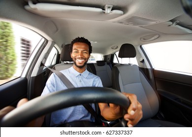 Close Up Portrait Of Happy African American Man With Beard Driving Car